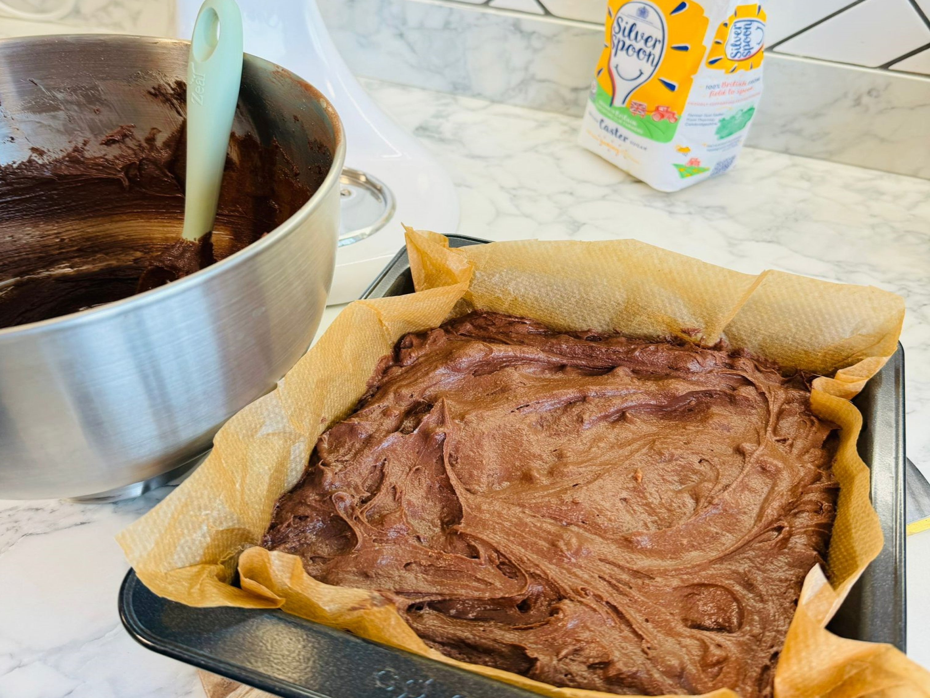 Mary Berry brownie batter mix inside a square baking tin lined with parchment