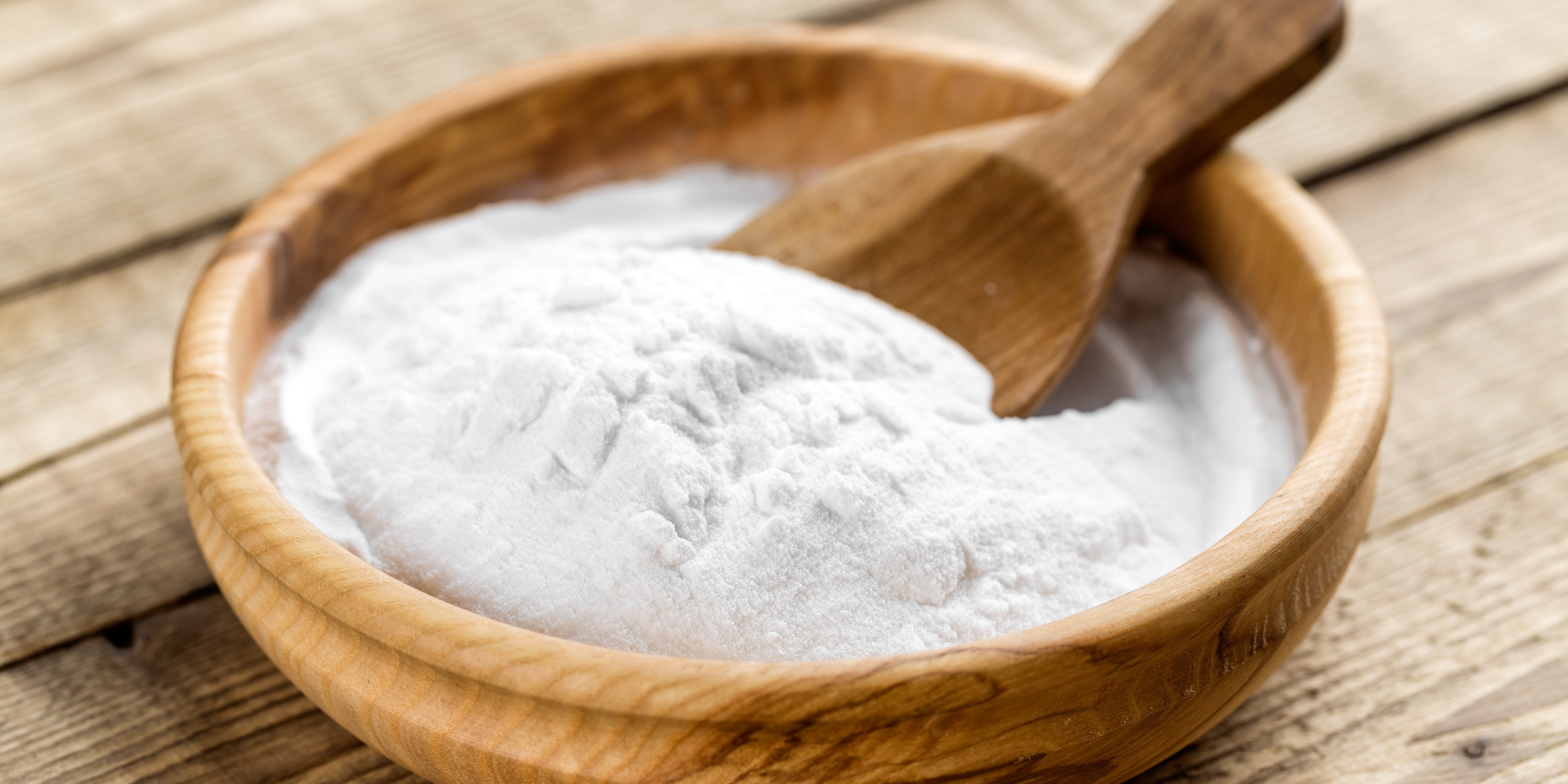 wooden bowl and wooden spoon with baking soda