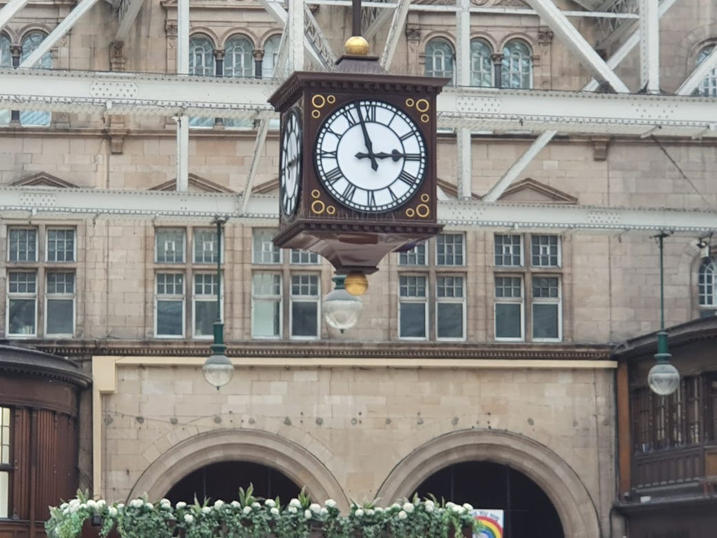 old fashioned clock hanging from the ceiling in Glasgow Central (C) Liz Warren-Corney