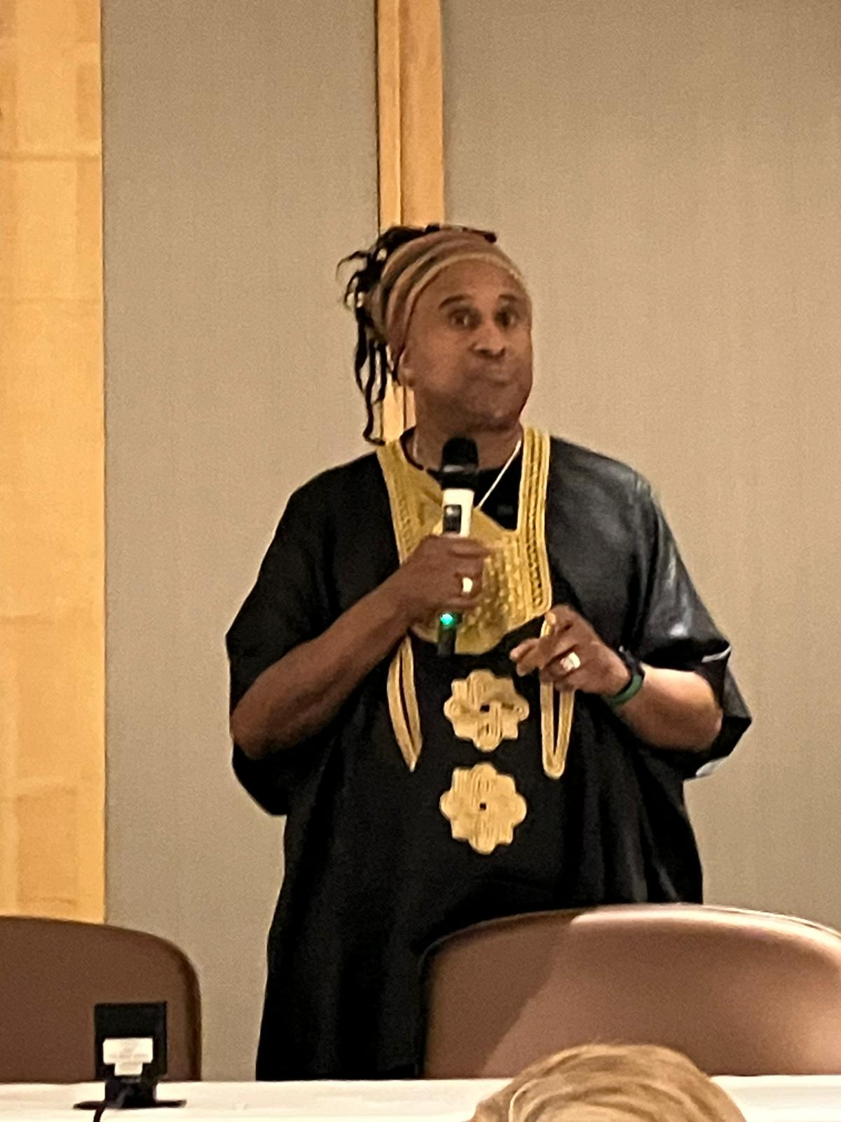 Activist, Roger Mackenzie, speaking to conference members at dinner. 