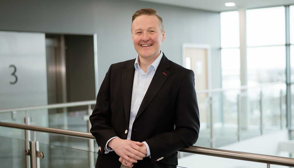 Executive, Nick Young, stood in Newcastle Building Societies head office. 