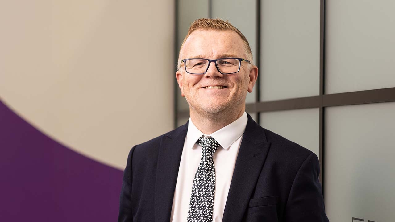 Newcastle Financial Adviser, Carl Shropshire, stood smiling in the Kings Street branch. 