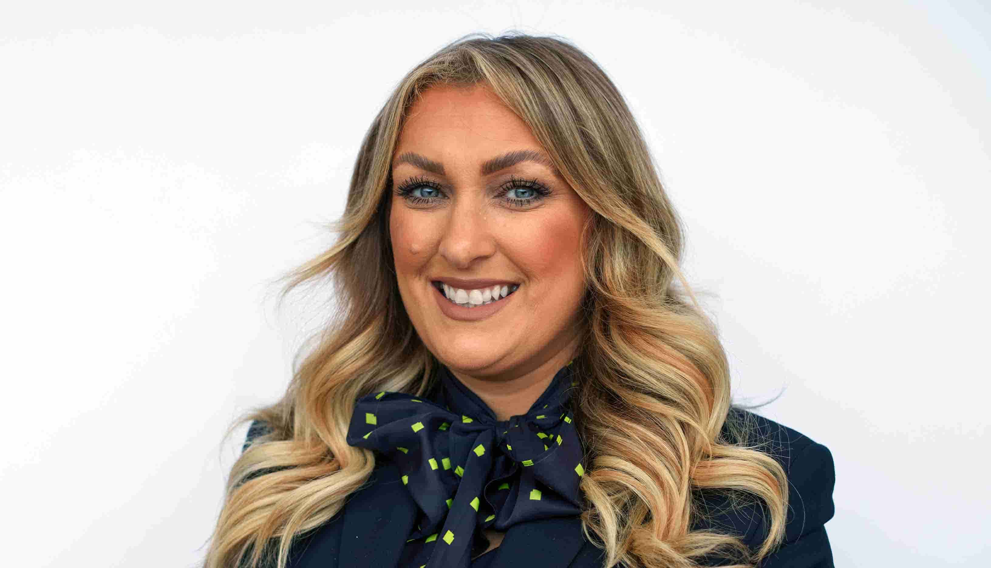 Ponteland's Branch Manager, Natalie, smiling with a white background. 