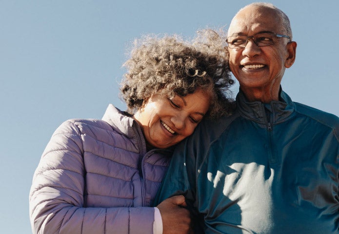 A man and woman hugging each other.