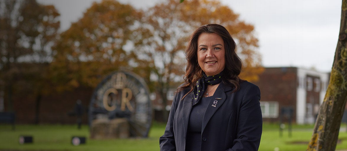 West Denton Branch Manager, Michelle, stood in a park smiling. 