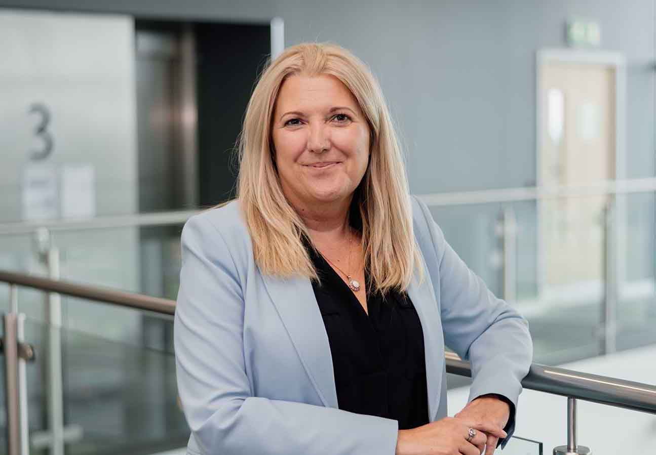 Board members, Karen McDonagh Reynolds, stood in the head office of Newcastle Building Society. 