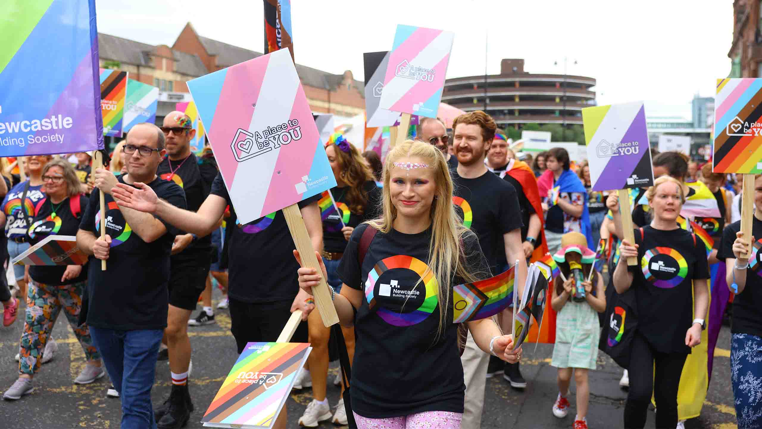 A group of people holding signs