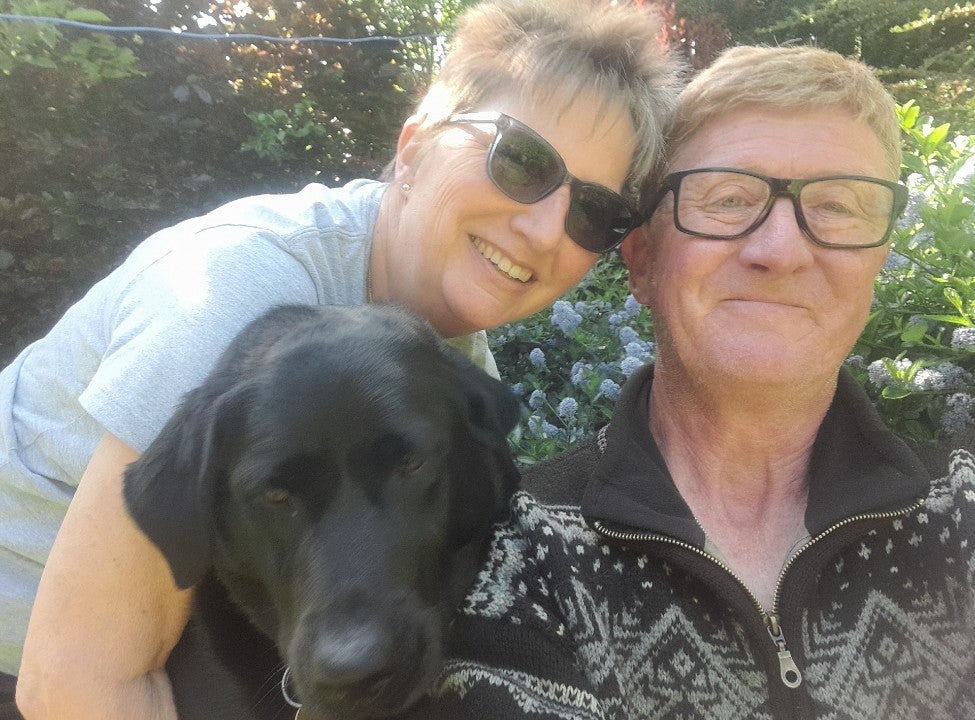 A man and a woman and their dog.