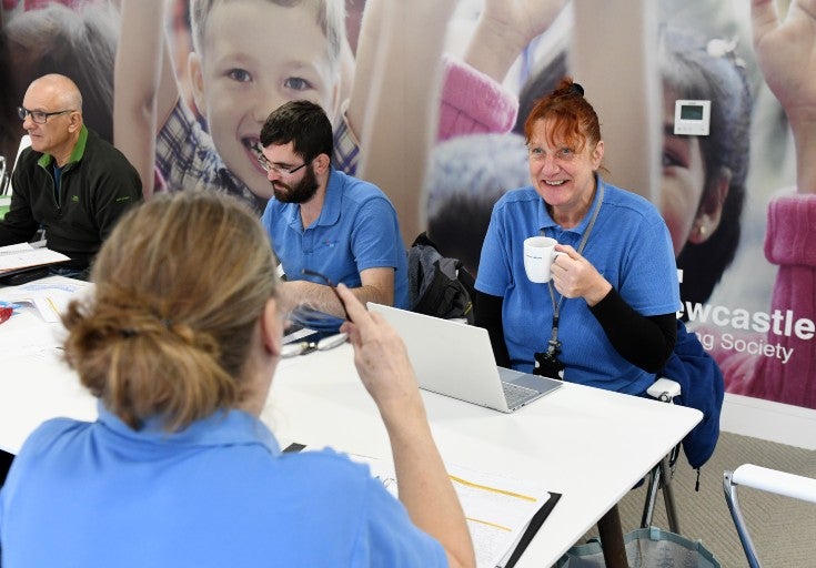 Four people enjoy a cuppa and a chat