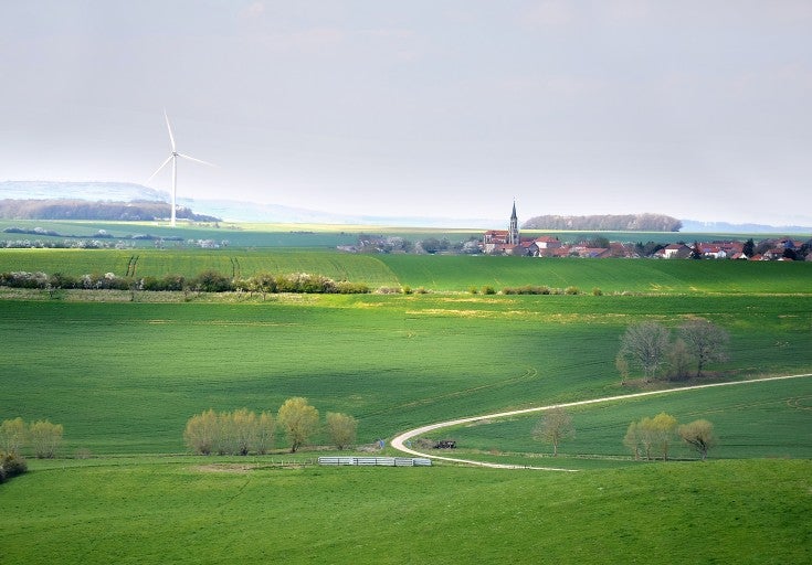 A field with a windmill
