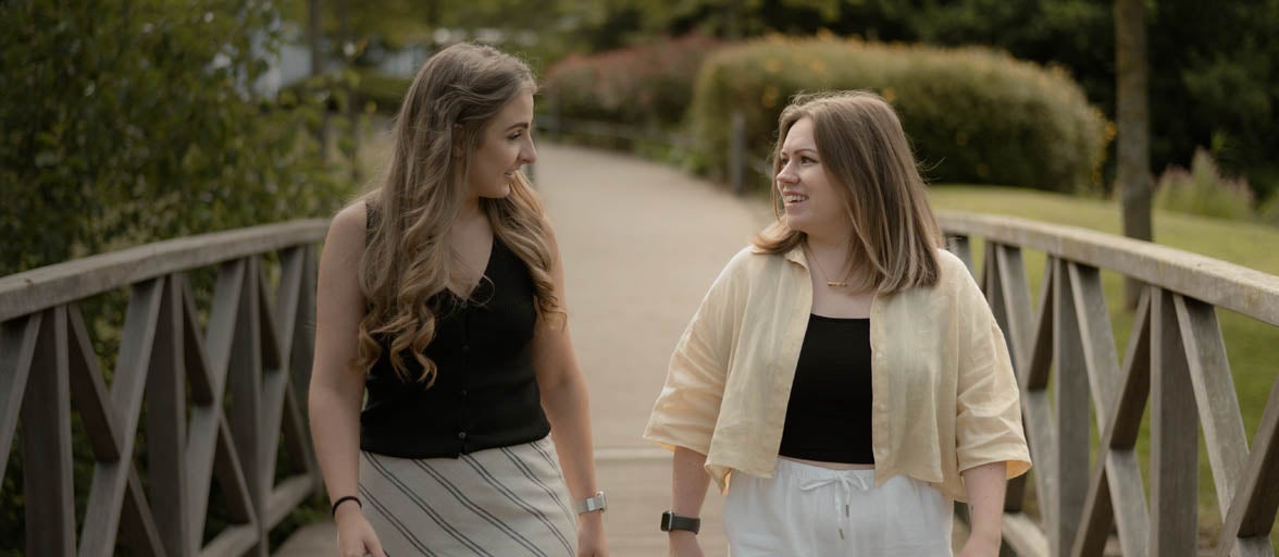 Two women walking on a path