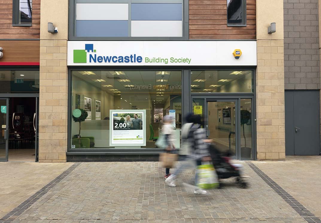 Gateshead branch exterior with out of focus people walking past. 