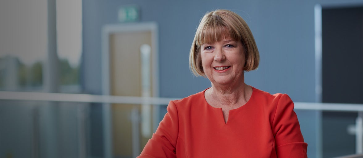 Board member of Newcastle Building Society, Ann Shiels, smiling in Cobalt office. 