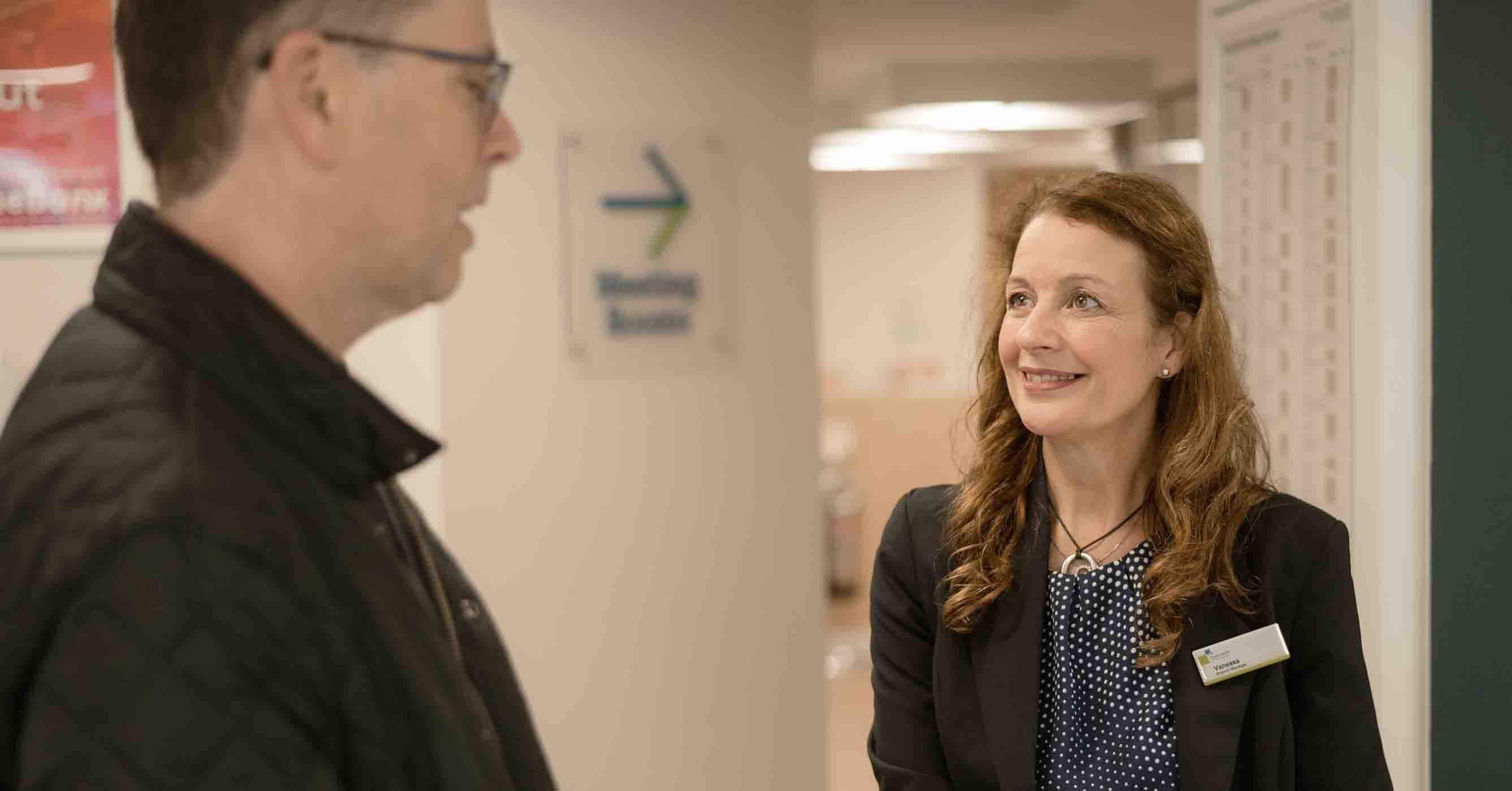 A customer talking to the branch manager.