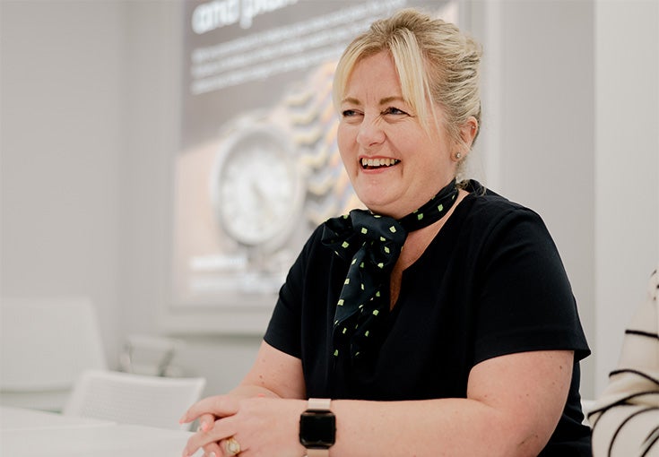 A woman smiling at the camera