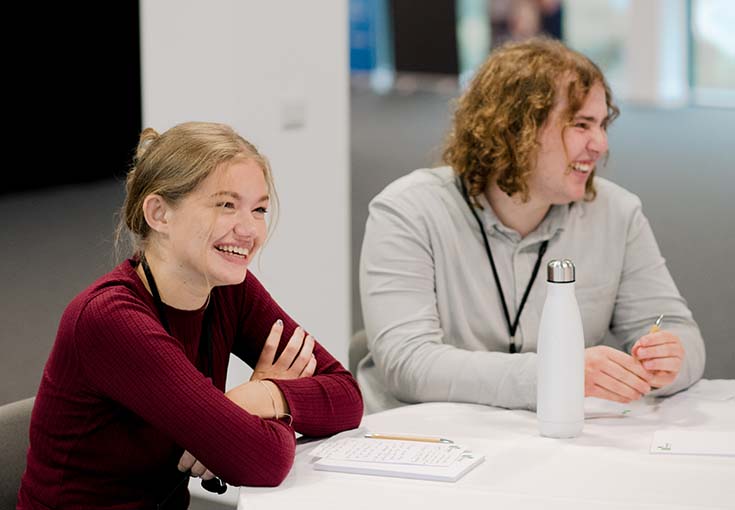A man and woman sitting at a table