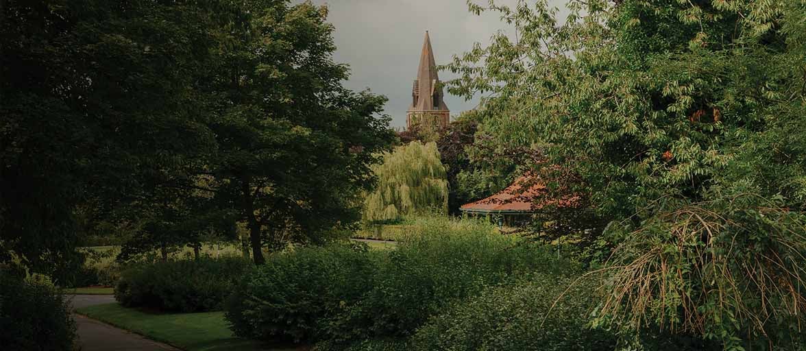 Landscape of trees and a church in Consett. 