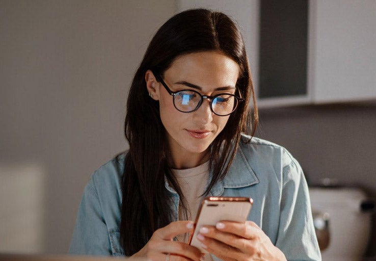 A woman looking at her mobile phone. 