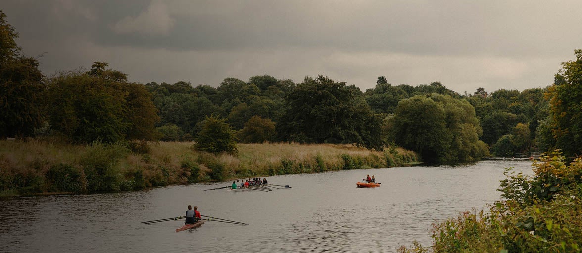 Yarm river, with 3 canoes with rowers inside. 