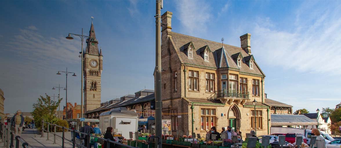 Darlington market place with fruit and vegetable stalls out. 