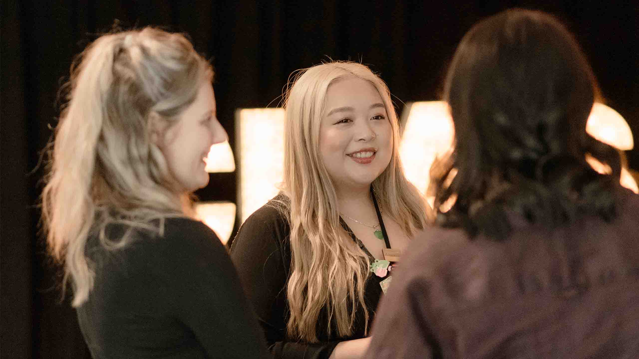 A group of women chatting in a circle