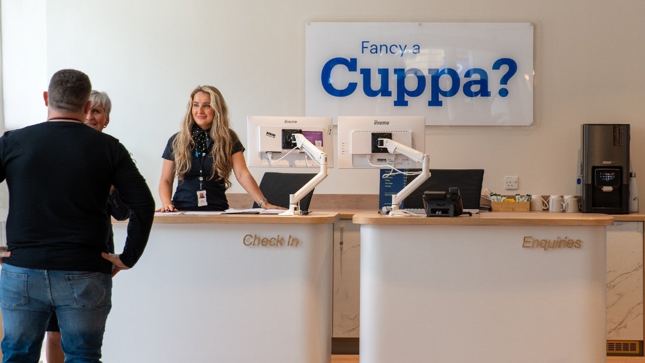 Customers at a welcome desk.
