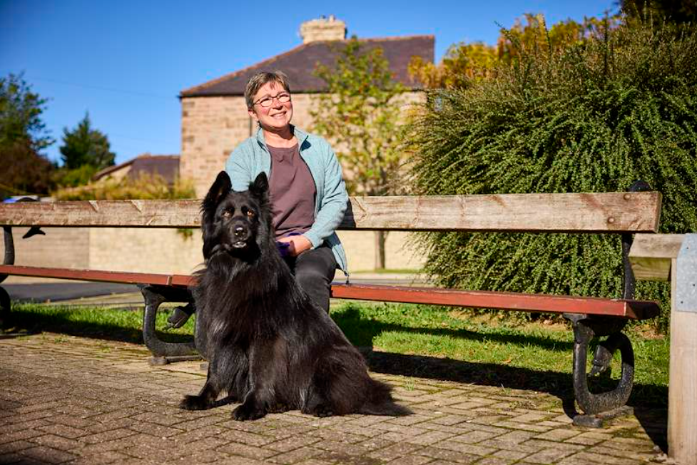 Kath, a savings member, and her dog Charley 