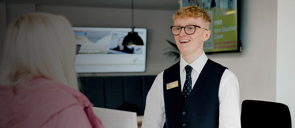 North Shields customer adviser with a member. 