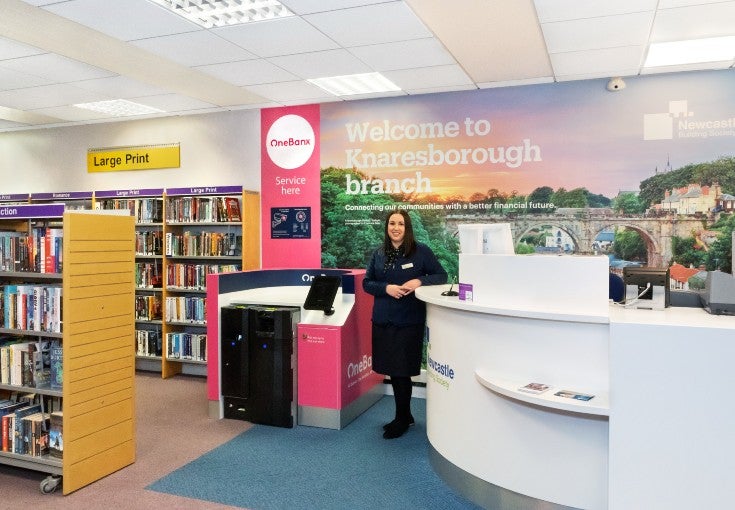 Knaresborough Branch Manager, Heather Pearman, stood next to the OneBanx kiosk inside the Knaresborough Library Branch