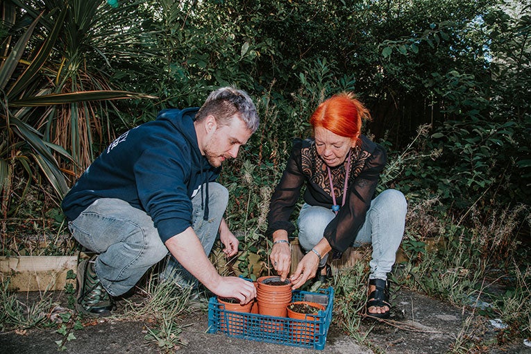Colleagues gardening with Parker Foundation
