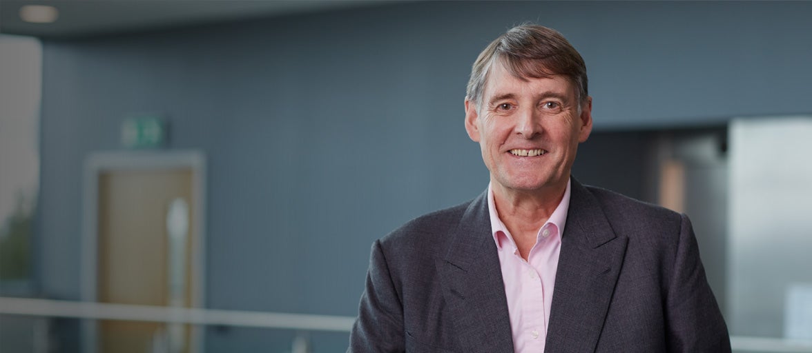 James Ramsbotham smiling stood in Cobalt office