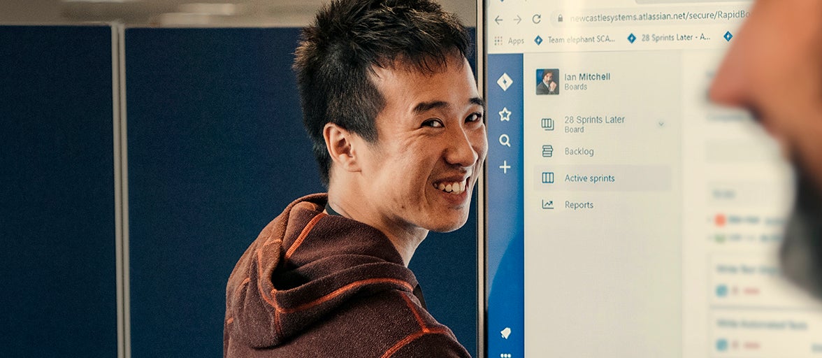 Colleague from our IT Development team presenting on a white board. 