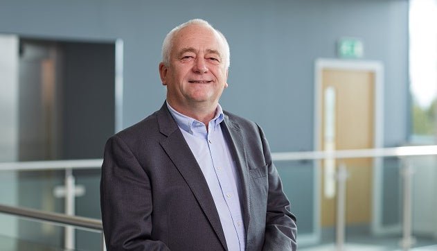 Mick Thompson smiling at camera in Cobalt office