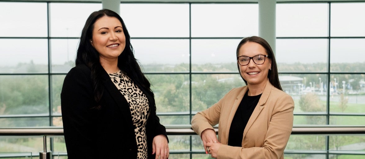 Two of our colleagues from Newcastle Financial Advisers inside our Head Office at Cobalt Business Park. On the left is Beth Hunter, Paraplanning Team Leader, and on the right is Beth Muir, Operations Team Leader.