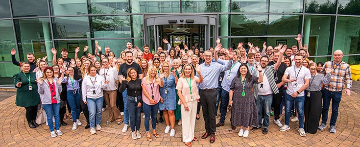 colleagues celebrating outside head office