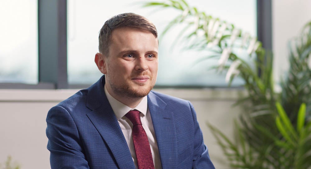 Matthew Shaw, Newcastle Financial Adviser smiling in a suit