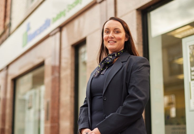 Sunderland Branch Manager, Donna, standing outside of our Sunderland branch smiling.