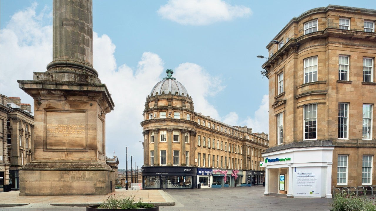 The Newcastle Building Society Monument branch with Grey's Monument beside it.
