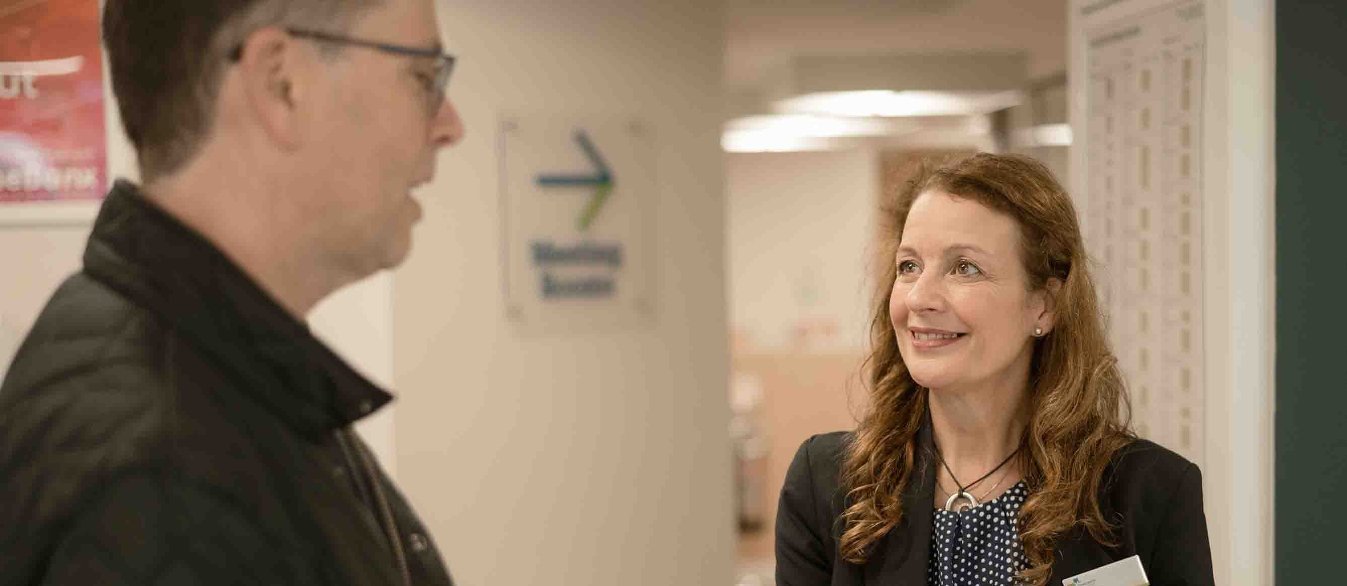 A customer talking to the branch manager.