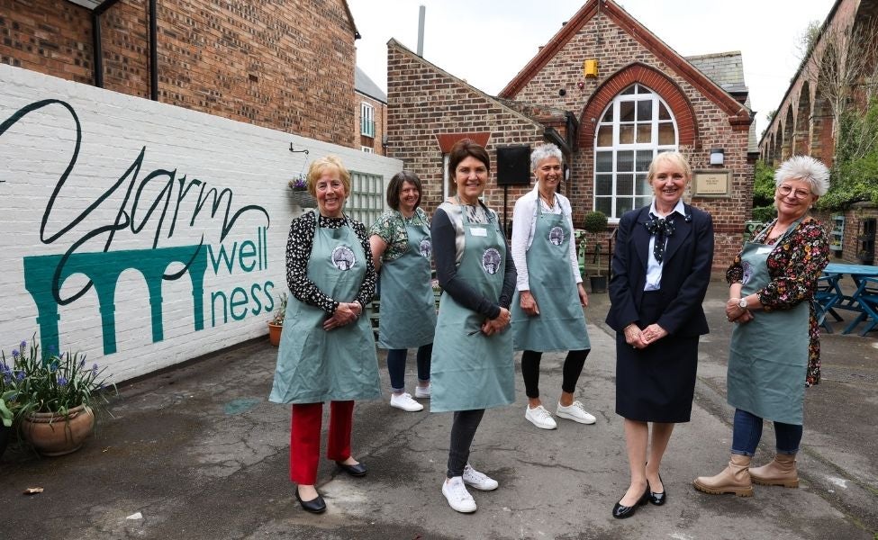 A group of women gather outside Yarm Wellness.