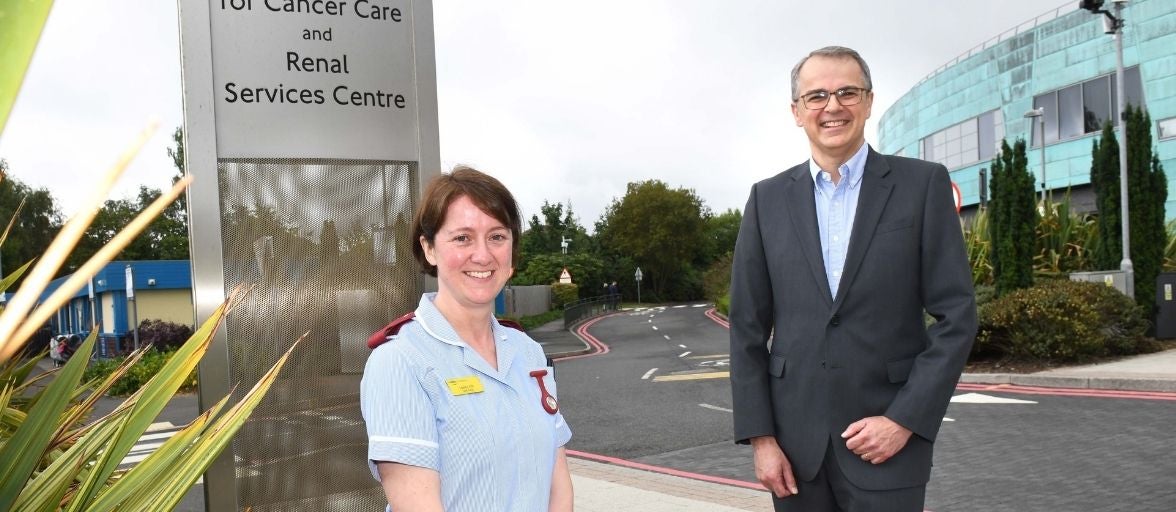 CEO Andrew Haigh with Sir Bobby Robson Foundation