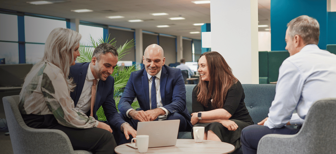 A group of people sitting around a table