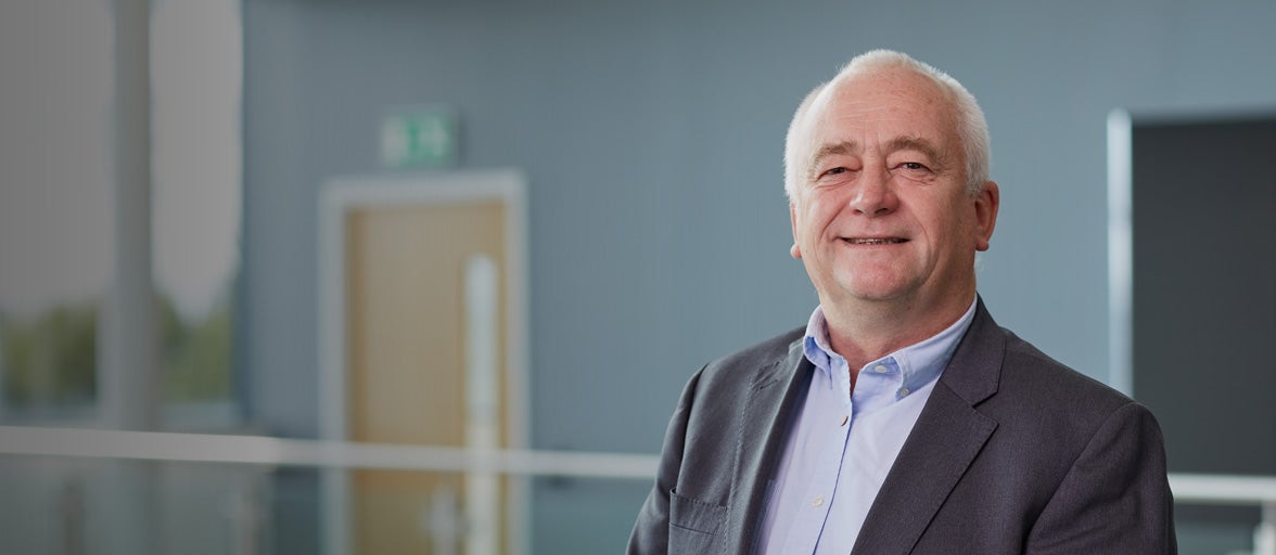 Mick Thompson smiling stood in Cobalt office
