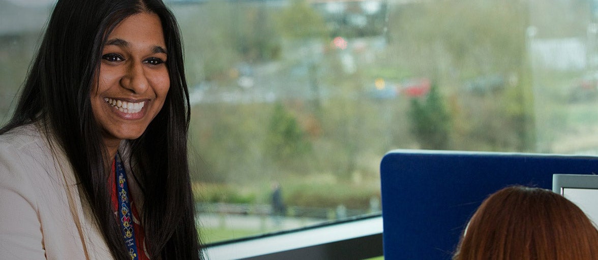 Two of our colleagues sat having a conversation