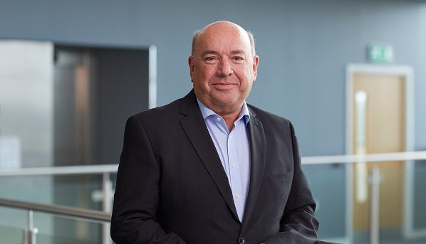 Bryce Glover smiling in Cobalt office.