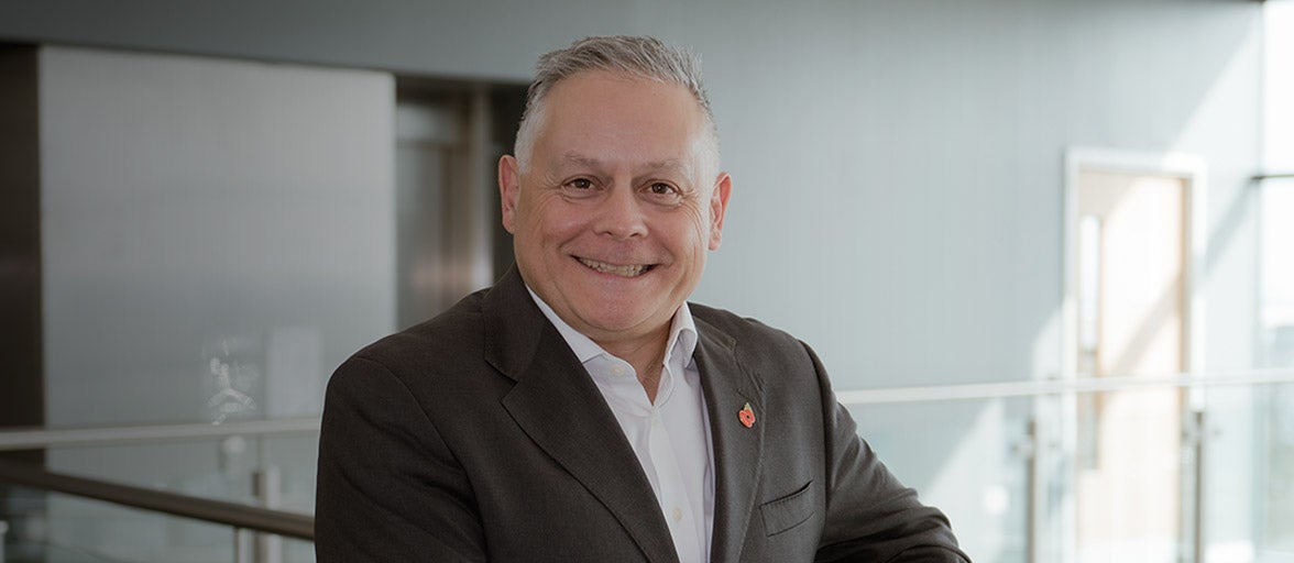 Board member, Paul Astruc, stood in the head office of Newcastle Building Society. 