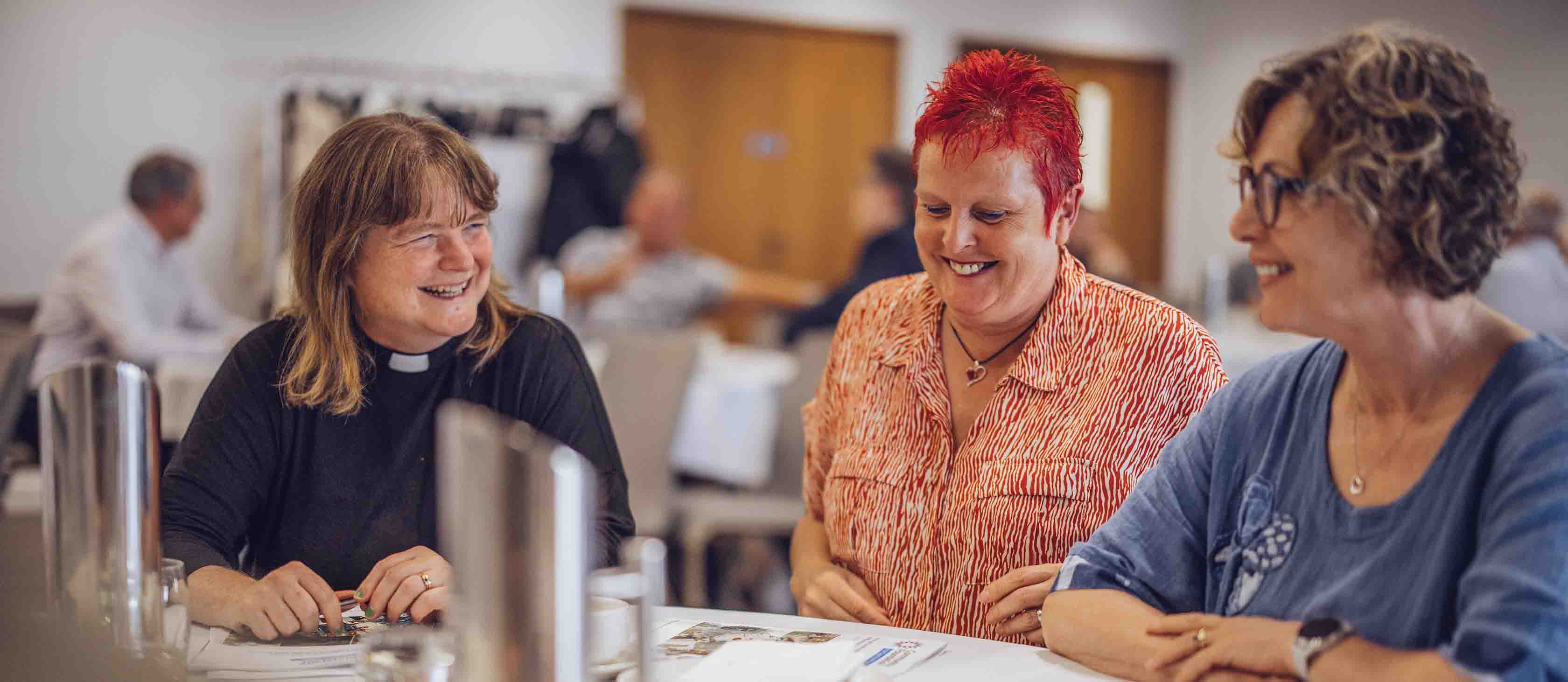 A group of women sitting at a table