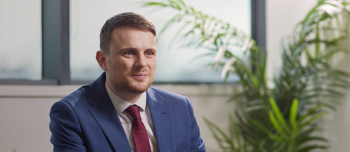 Matthew Shaw, Newcastle Financial adviser smiling in a suit