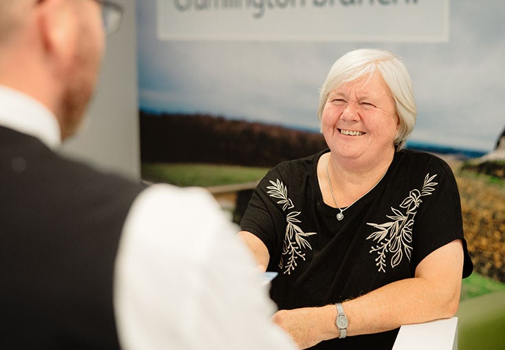 A woman smiling at a man