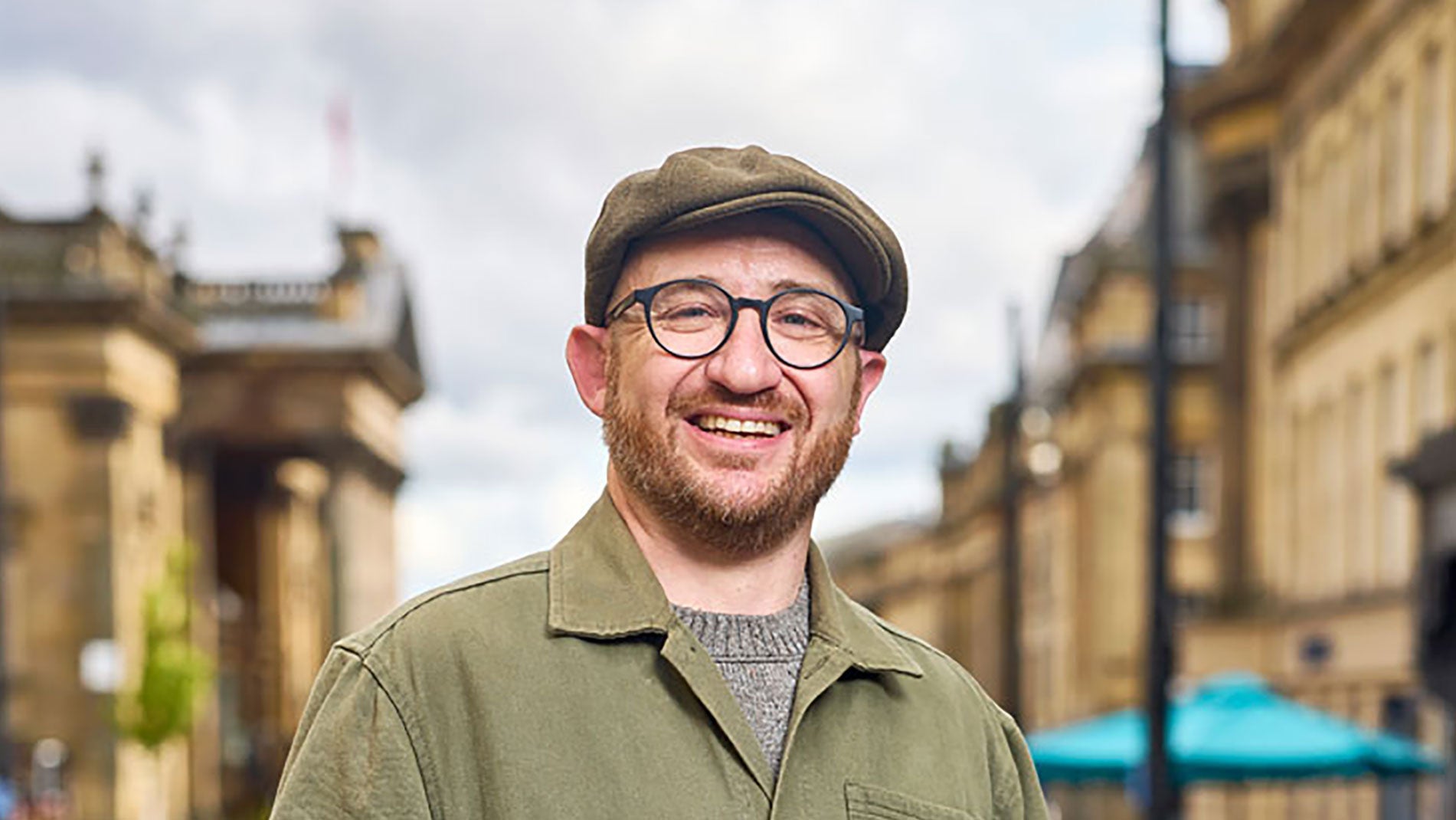 A man in a hat stood on Grey Street in Newcastle.